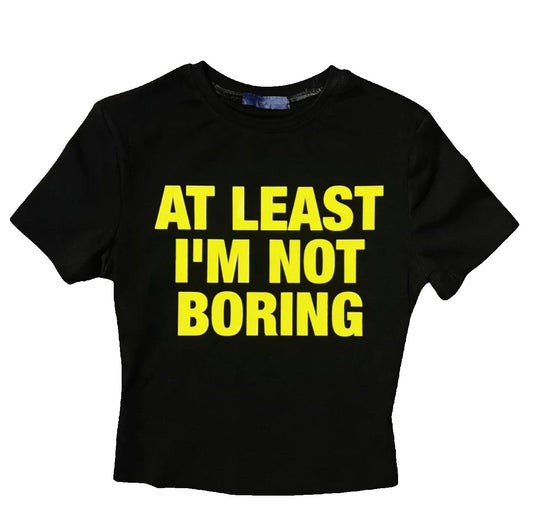 “AT LEAST I’M NOT BORING” SHORT SLEEVE CROP TOP TEE